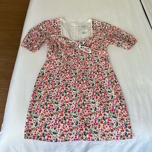 Sweet and sexy summer dress with detailed neckline and cut out.